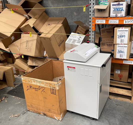 Carboard shredder sitting in warehouse.